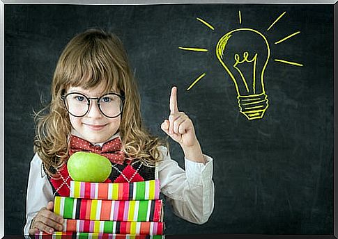 Creative girl with books and a light bulb