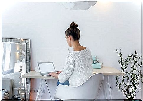 Woman at a desk with minimalist decor