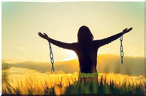 Woman breaking the chains of social judgment