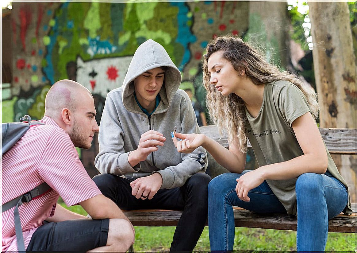 Teenagers smoking in a park