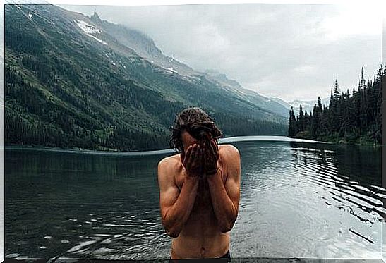 man coming out of the water enjoying alone