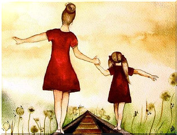 mother and daughter walking along the train tracks holding hands