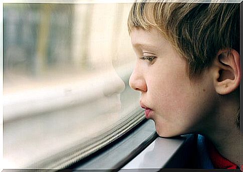 Autistic child looking out the window