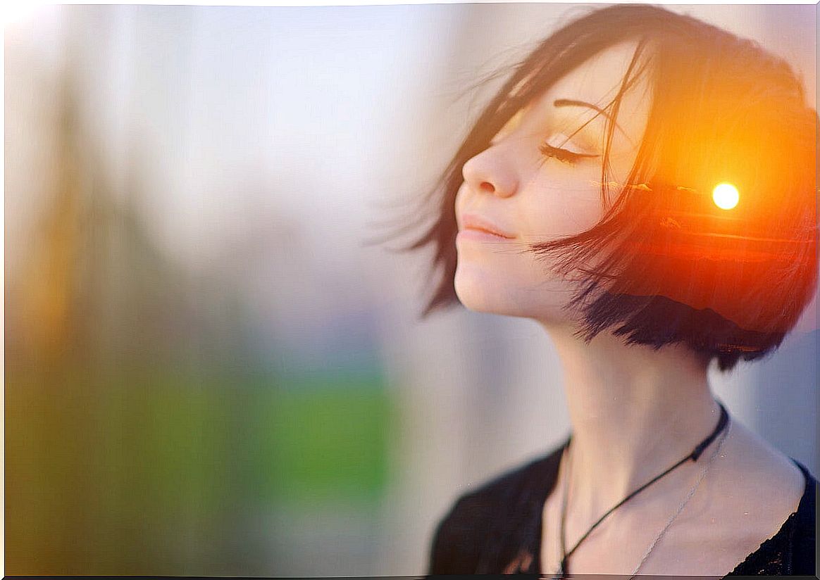 Woman with eyes closed with a light in her mind