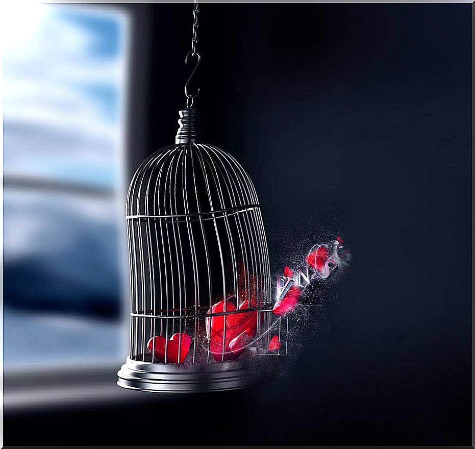 Caged heart breaking free as a symbol of personal development