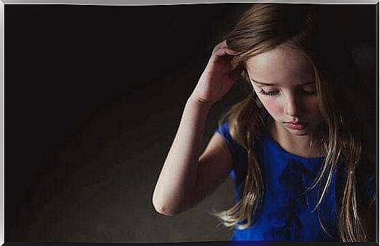 Girl touching her hair symbolizing the effect of the quiet child