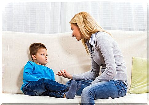 Mother talking with her son not to educate a quiet child