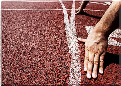 Hands of an athlete at the starting line