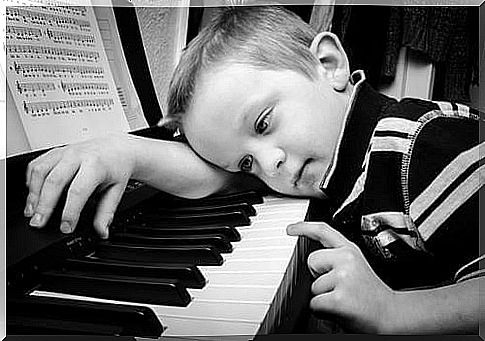 discouraged child at the piano