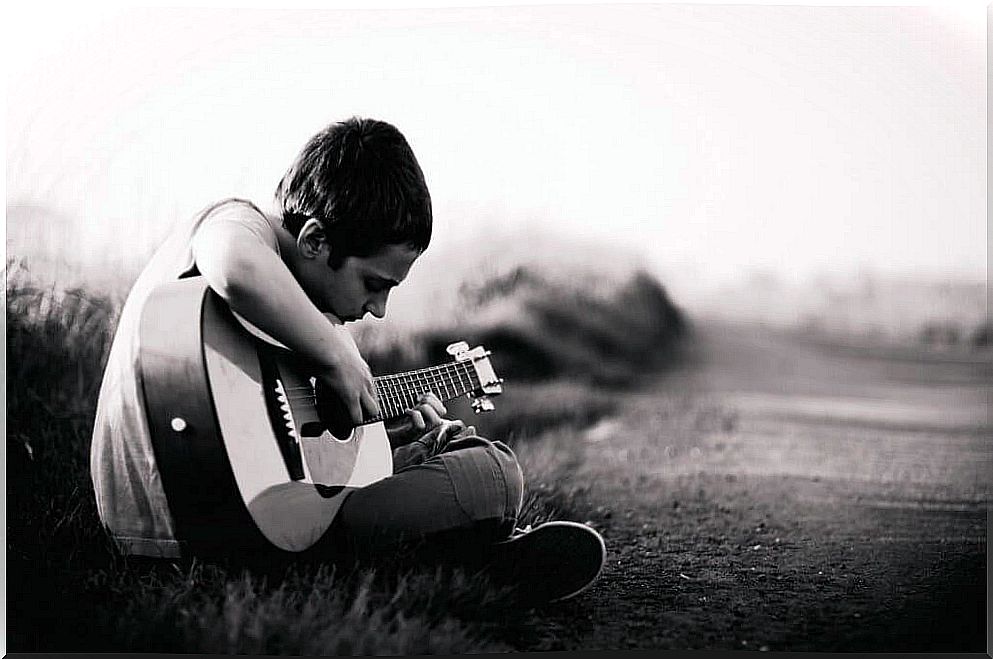 discouraged boy with guitar