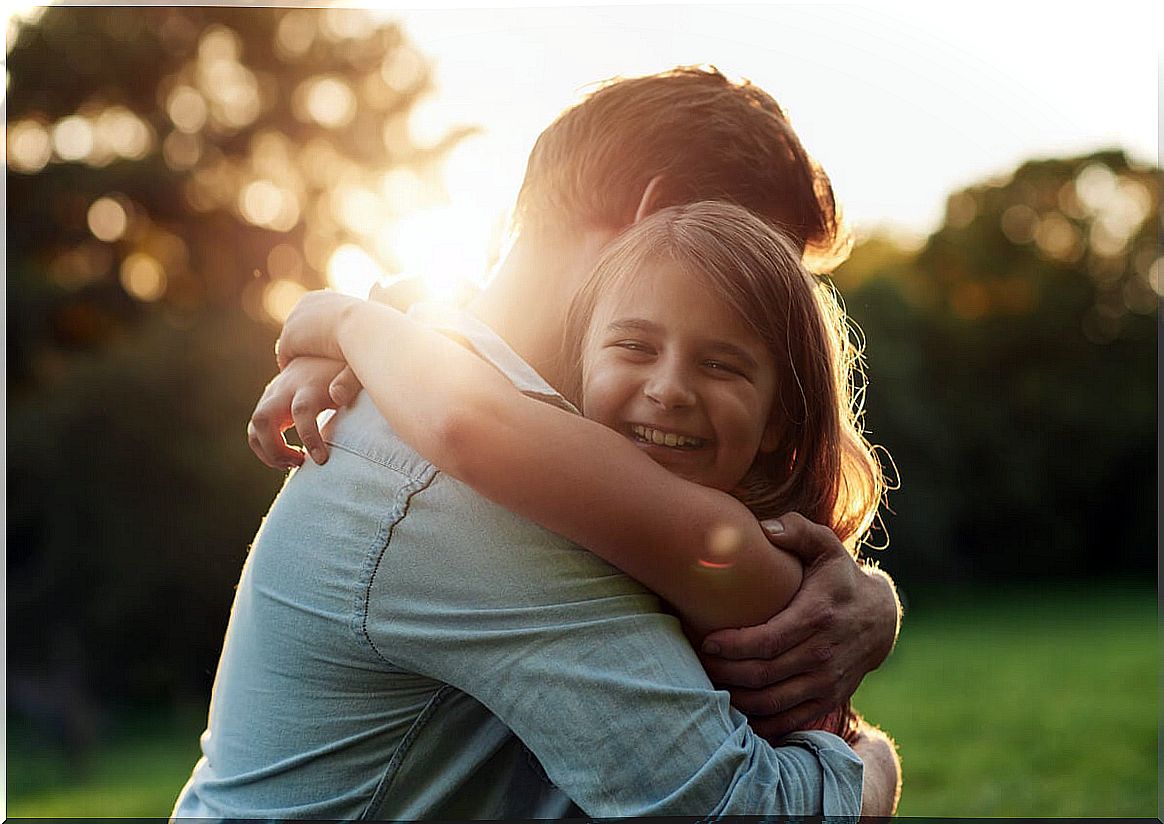 Father hugging his little daughter