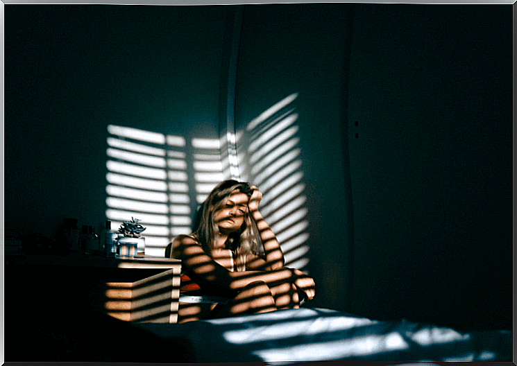 Depressed woman in her room